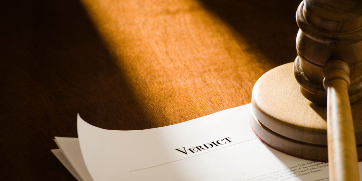 'Verdict' as a title on a piece of paper next to a gavel.
