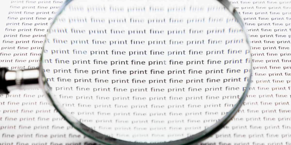 Magnifying glass on paper that repeatedly says 'fine print'