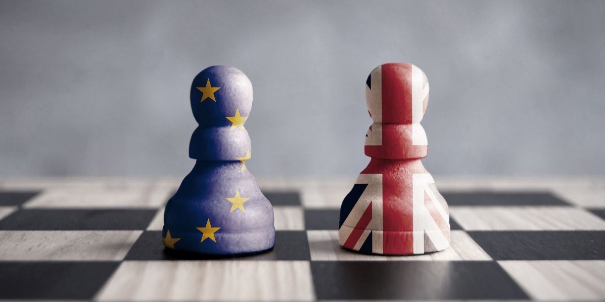 Two pawns with the EU and UK flag on them.