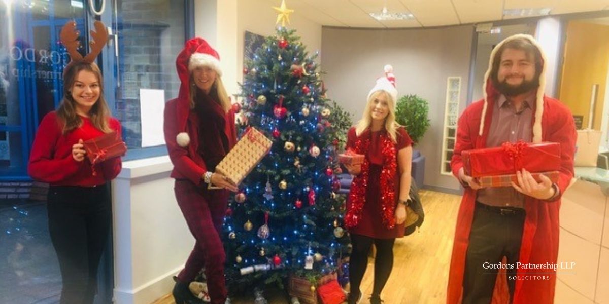 Christmas tree with members of Gordons dressed up as santa
