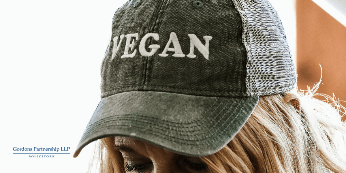 Woman wearing a vegan cap