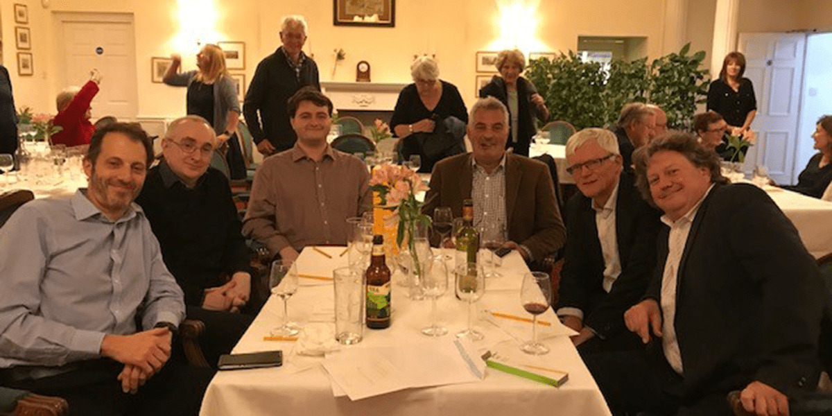 A group of people at a table with drinks