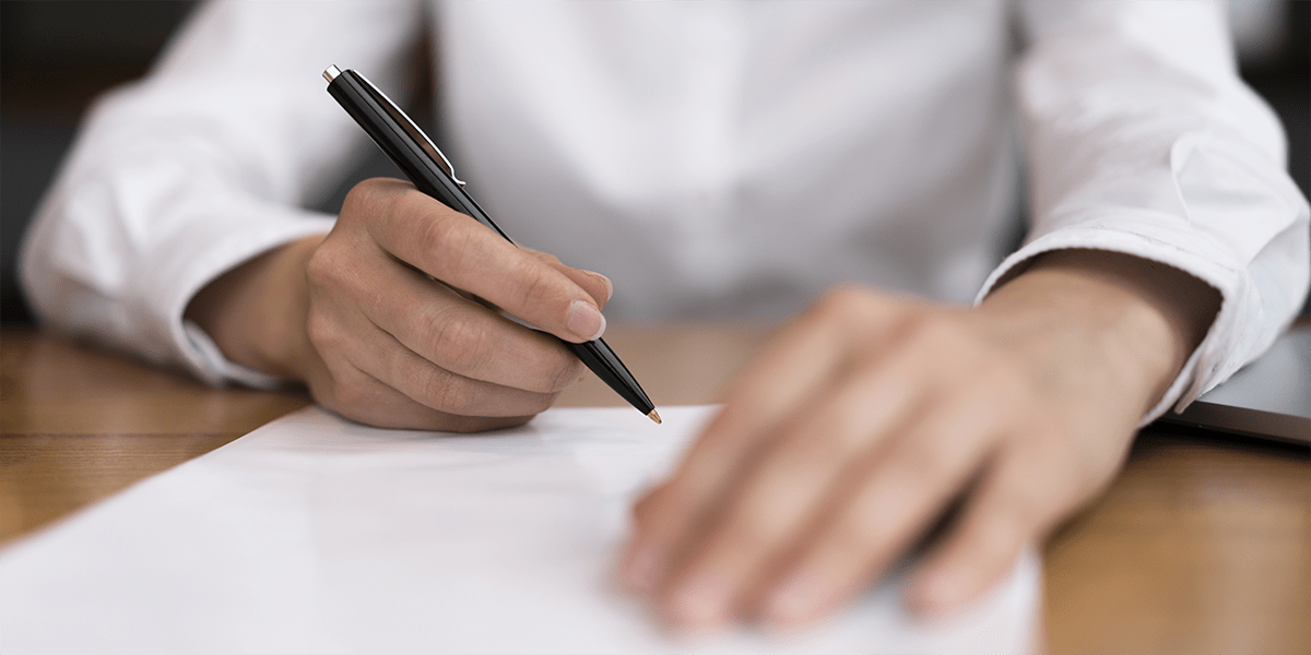 Man writing in a document
