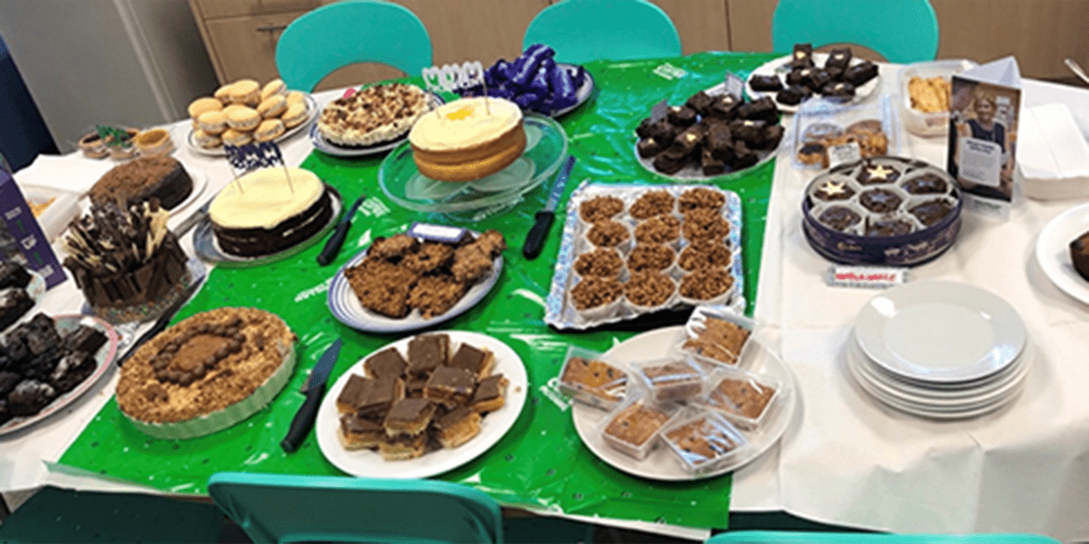MacMillan table with snacks and cakes.