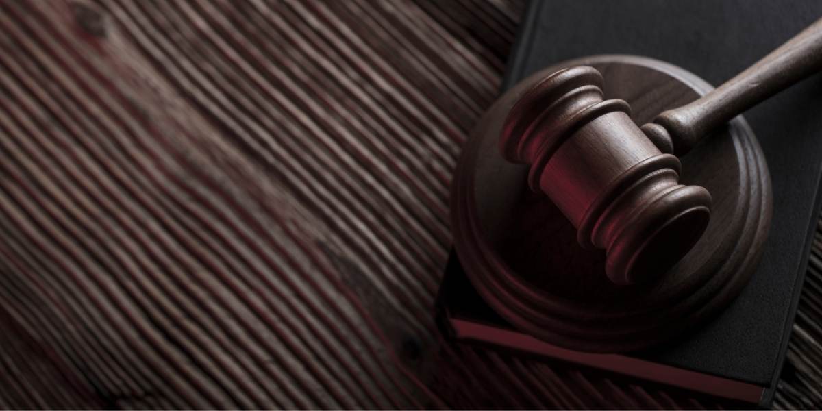 Close-up Of Legal Gavel On Woodern Table