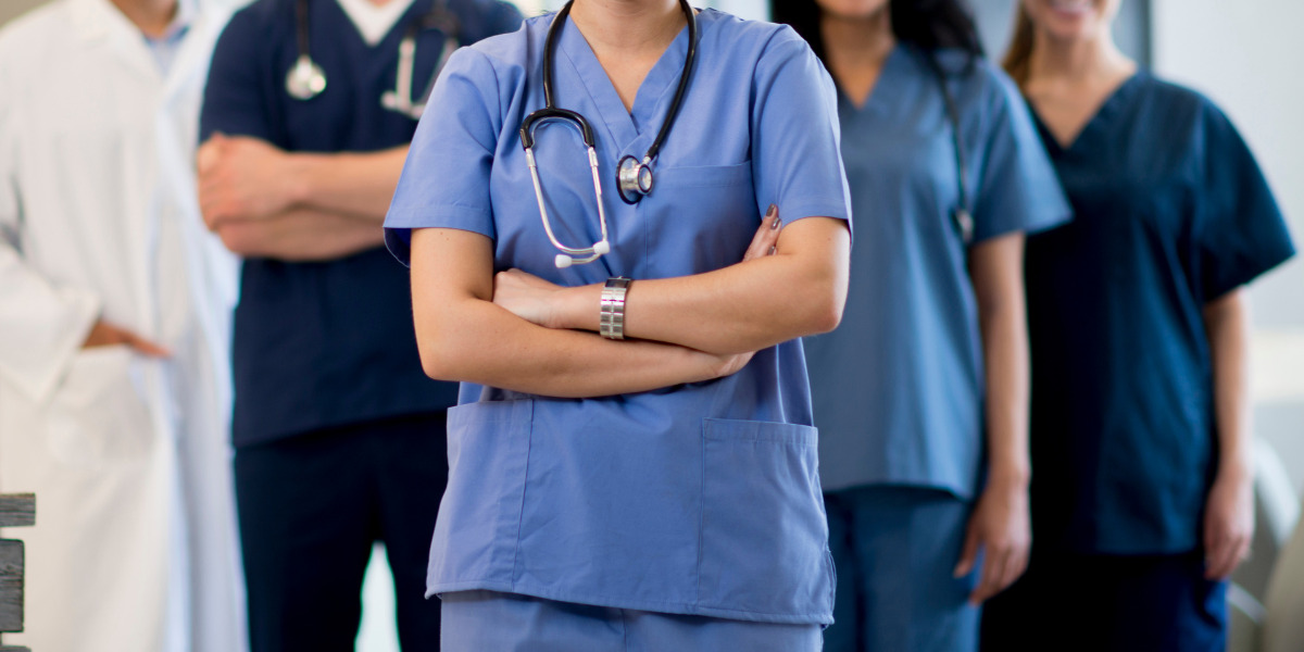 Doctors and nurses facing the camera.