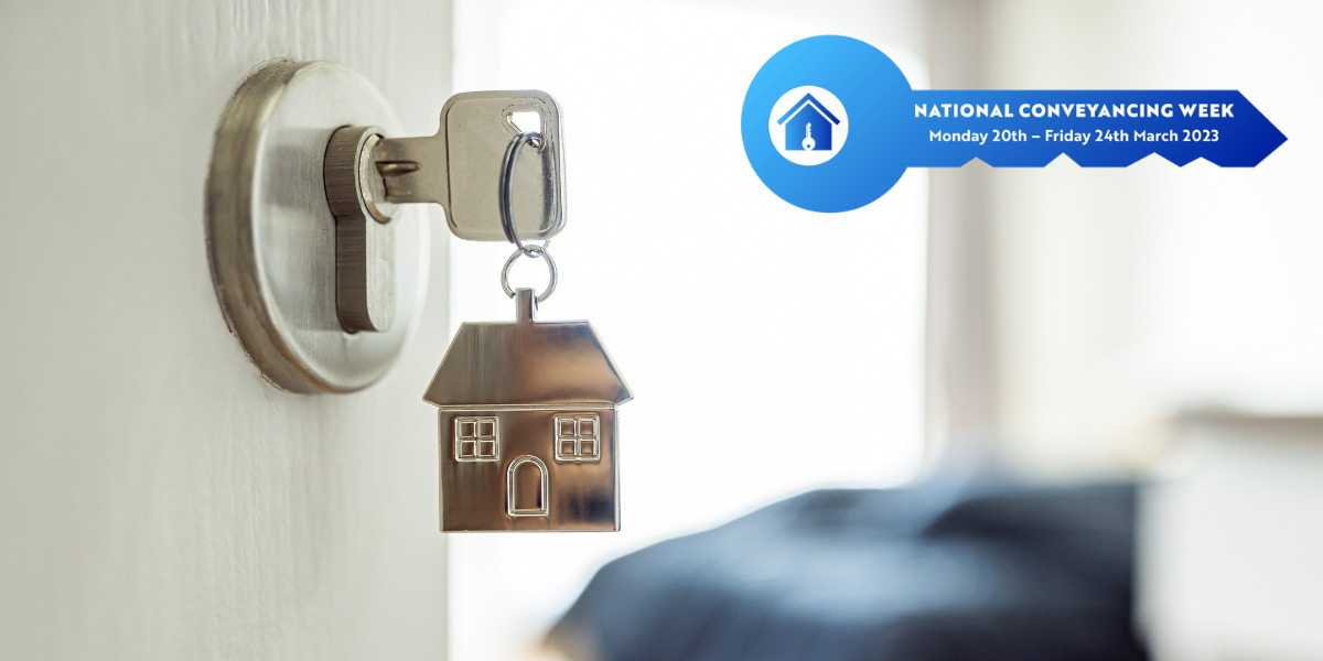 Key with a house symbol in a door keyhole and a blue key saying "National Conveyancing Week"