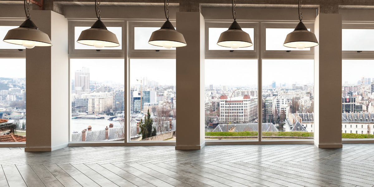Image of an empty office building overlooking a city.
