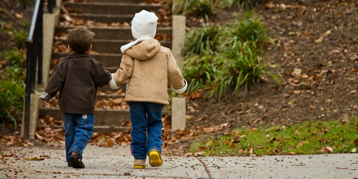 Two children holding hands